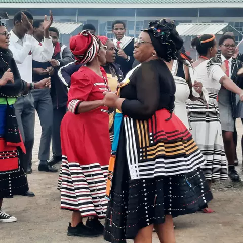Teachers at the Ekuphumleni school greet a project-visit group from the Umckaloabo Foundation